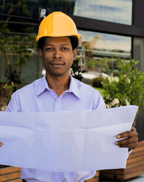 portrait-professional-architect-helmet-looking-blue-prints-outside-modern-building-engineer-architect-concept